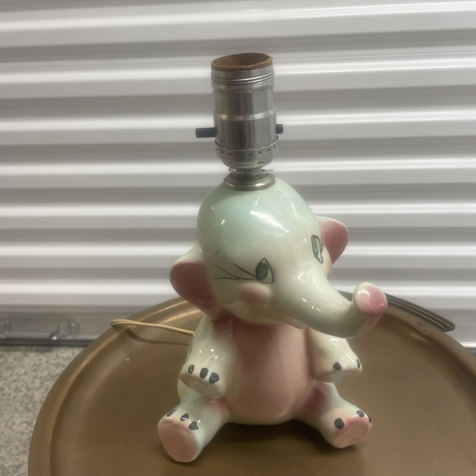 Vintage Tot Line Dumbo Style Elephant Table Lamp located near the Miami Design District and measures 7” d x 6” w x 9.75” h