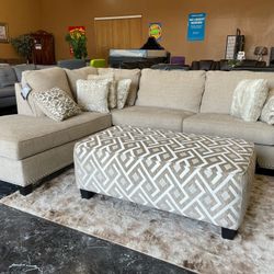 Beige Sectional with Ottoman and Rug