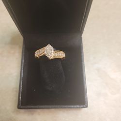 14 K Gold Diamond Ring.  Weight Is 4.4 Grams