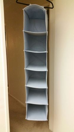 Hanging closet shelf