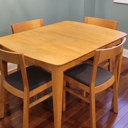 Kitchen Table with Four Chairs and Extension Leaf. 
