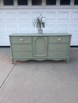 Sage green dresser with gold hardware