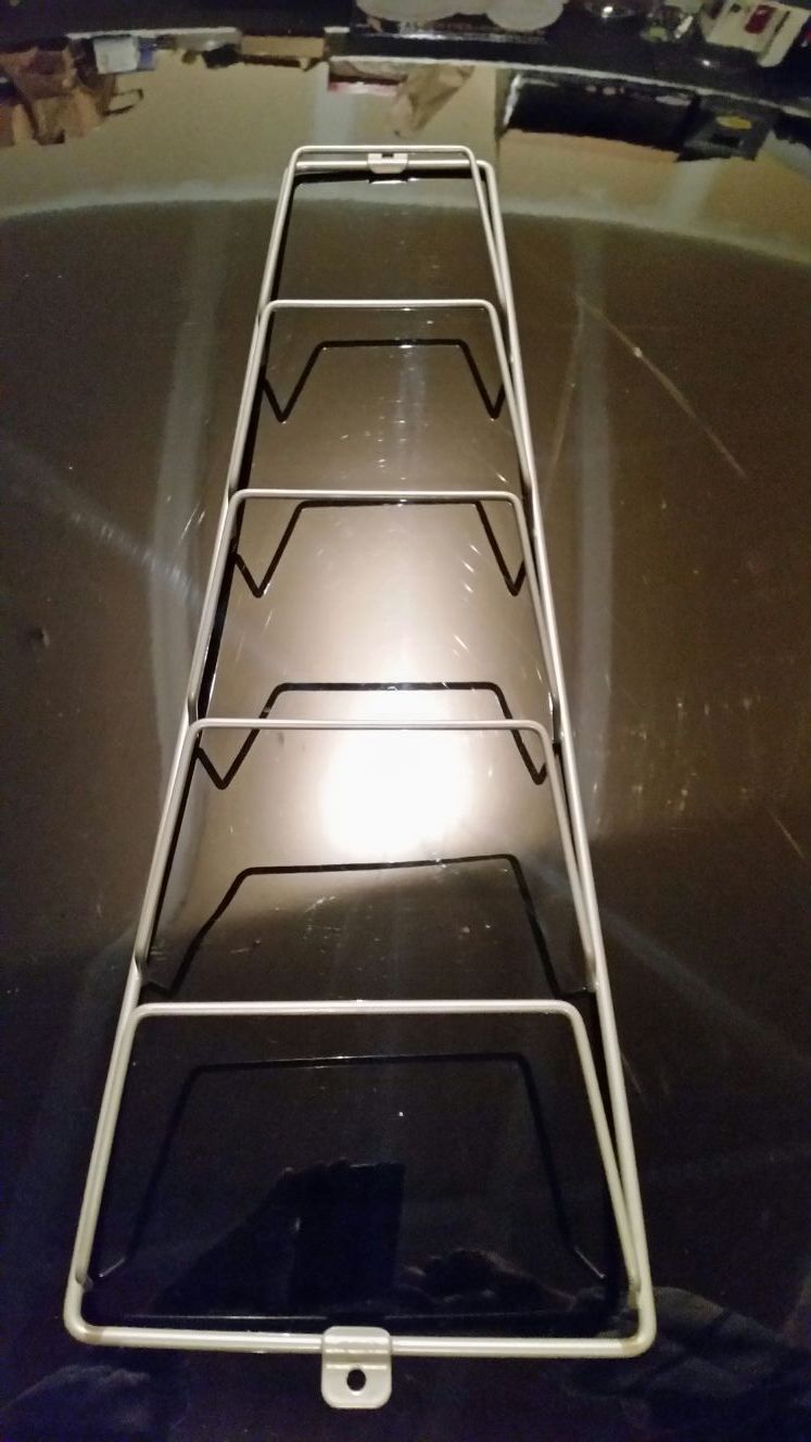 Ikea magazine/lids wall/cabinet rack.