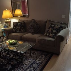 Family Room . Couch , Love Seat, Glass Tables 
