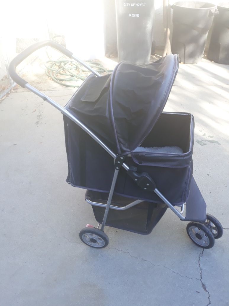 Dog stroller with sheep skin pad