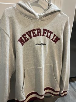 Women’s medium “Never fit in” hoodie