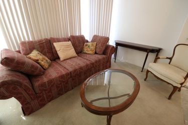 Couch, chair, coffee table, and wall table