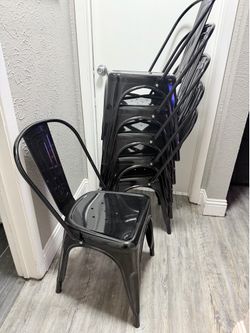 Set of six black metal chairs