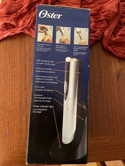 Oster Electric Wine Opener with Charging Base in original box and wrapping   Box looks slightly damaged