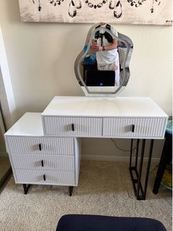 White vanity with velour chair