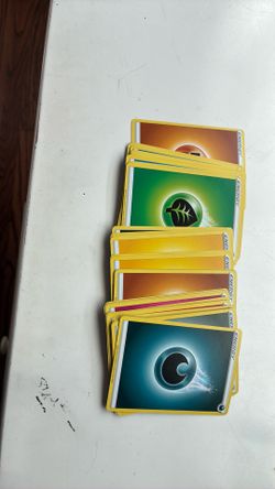 Huge stack of mixed energy Pokémon cards
