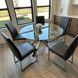 Round Glass Breakfast Table With 5 Grey Chairs. Lightly Used $1000