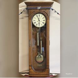 Howard Miller Weight Driven Solid Oak Wall Clock