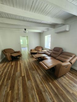 New Real leather power reclining sofa & 2 recliner chairs, staging only