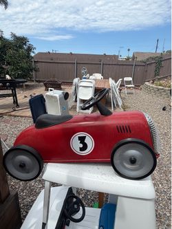 Kids ride on cars.