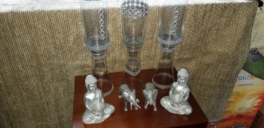 Glass vases with buddha candle holders