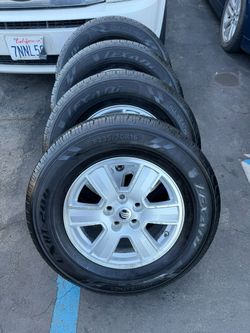 235/70R16 Lexani Tires & OEM 16" Alloy Wheels (Set of 4)