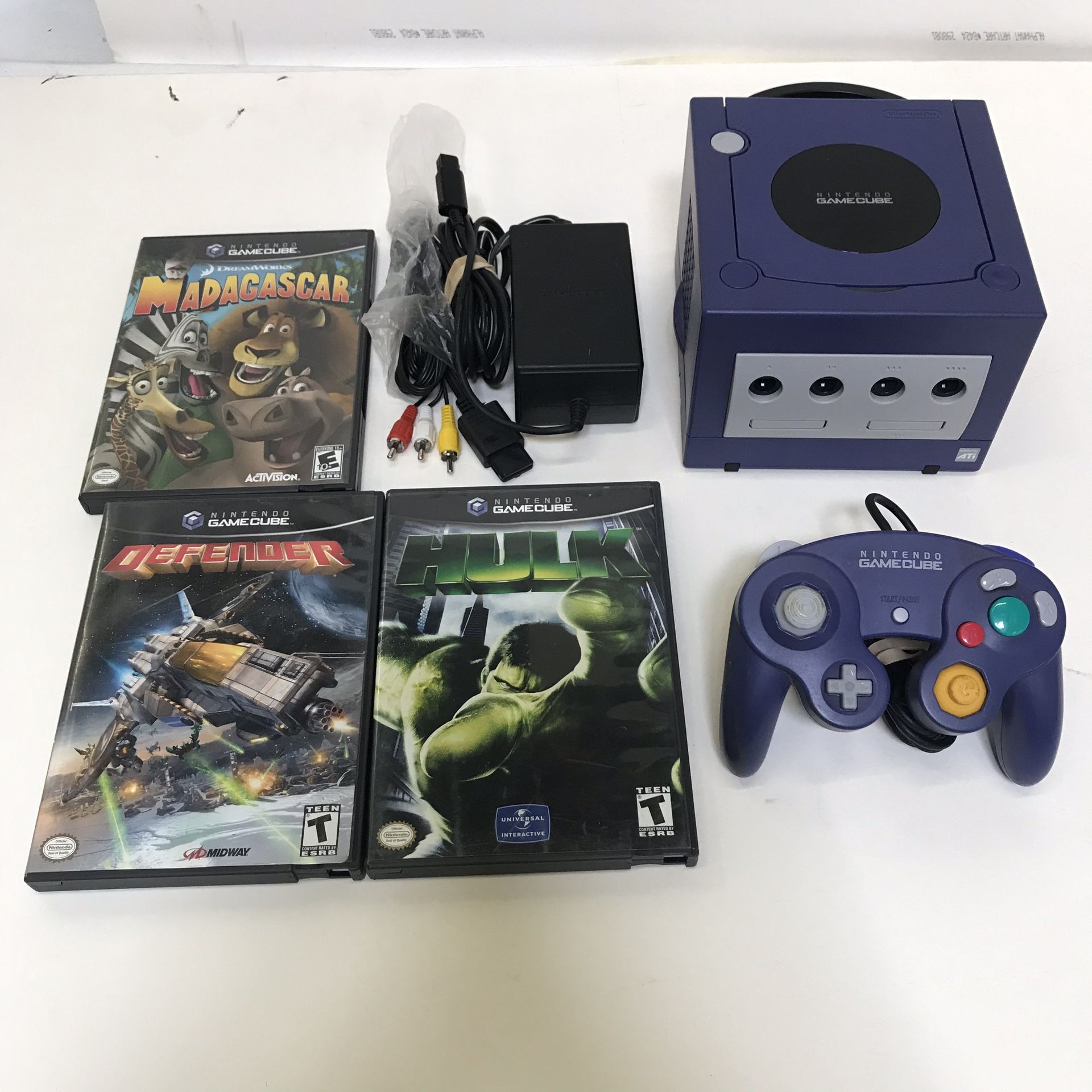 Purple Nintendo Gamecube system console with 3 games and controller