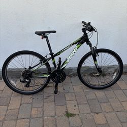 GIANT green and black mountain bike