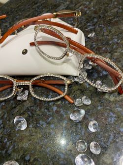 One (1) Millionaire Executive Unisex wooden frame with sparkling lab, diamond ice trim. Comes with a white protective case for secure storage. Comfort