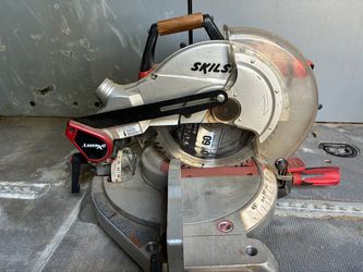SKIL (or SKILSAW) Compound Miter Saw equipped with a LaserX2 cutline guide system.