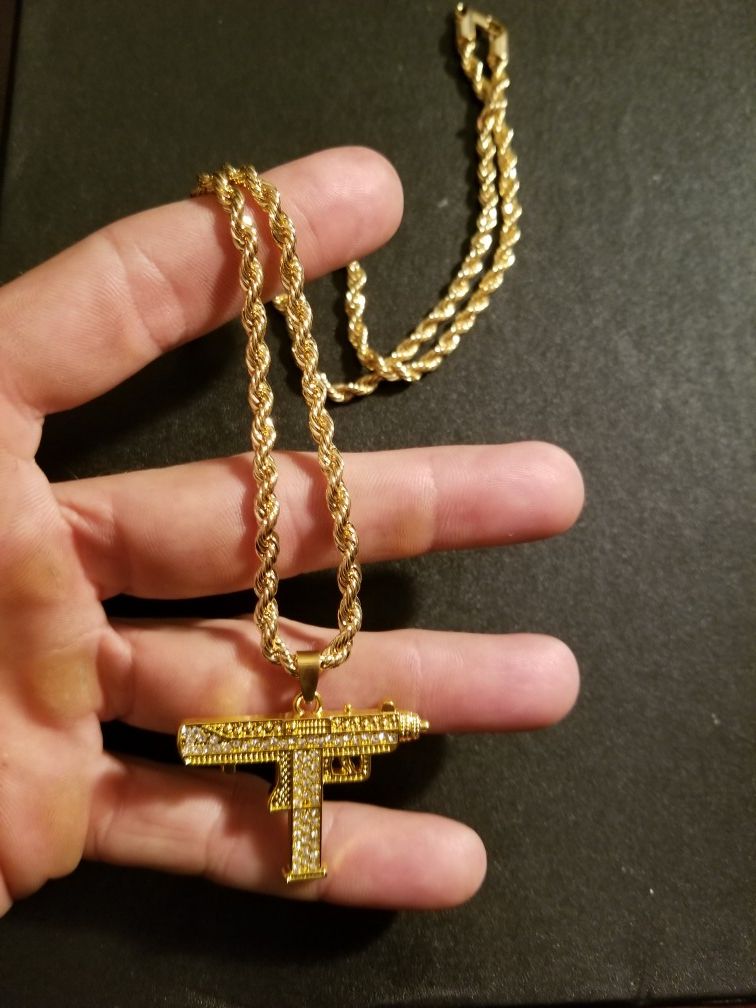 14k gold plated uzi pendant on 24' rope chain.