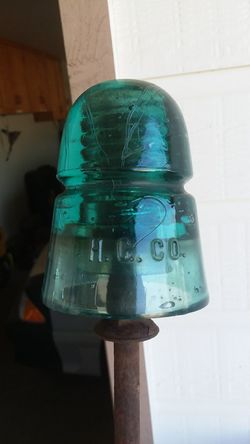 Antique glass insulator, H. G. CO