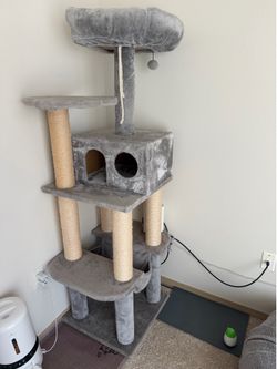 Cat tree, 27” L × 19” W × 62” H.