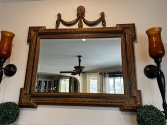 Antique gold mirror with decorative design