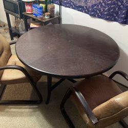 Round Table And leather Chairs