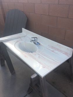 Vanity top with moen faucet in great shape.