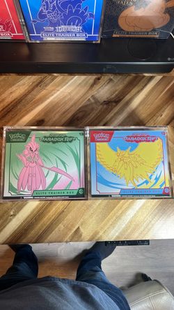 Pokémon Scarlet and Violet Paradox Rift ETB’s with acrylic cases