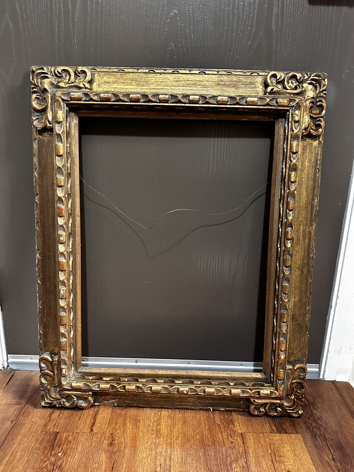 Medium-large sized gold/brass painted antique frame