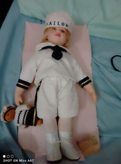 Box of antique rubber and porcelain dolls first come first serve