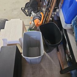 Two waste baskets one super narrow