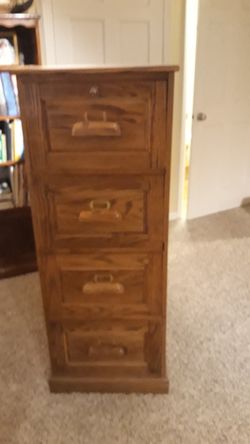 4 drawer oak filing cabinet with key 75.00