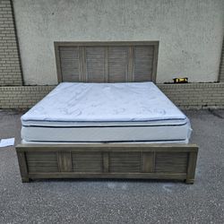 King-size Cindy Crawford's bed frame with brand-new King size Plush Pillow top mattress and box spring in plastics