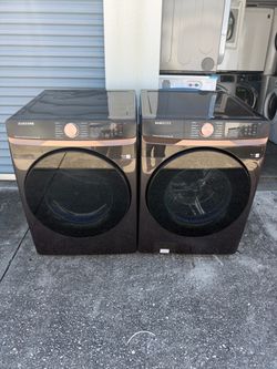 Front-loading stackable Samsung washer and dryer set with 2 months warranty, delivery and installation available    700