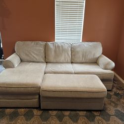 Light Grey Couch With Chaise, Chair, And Movable Ottoman