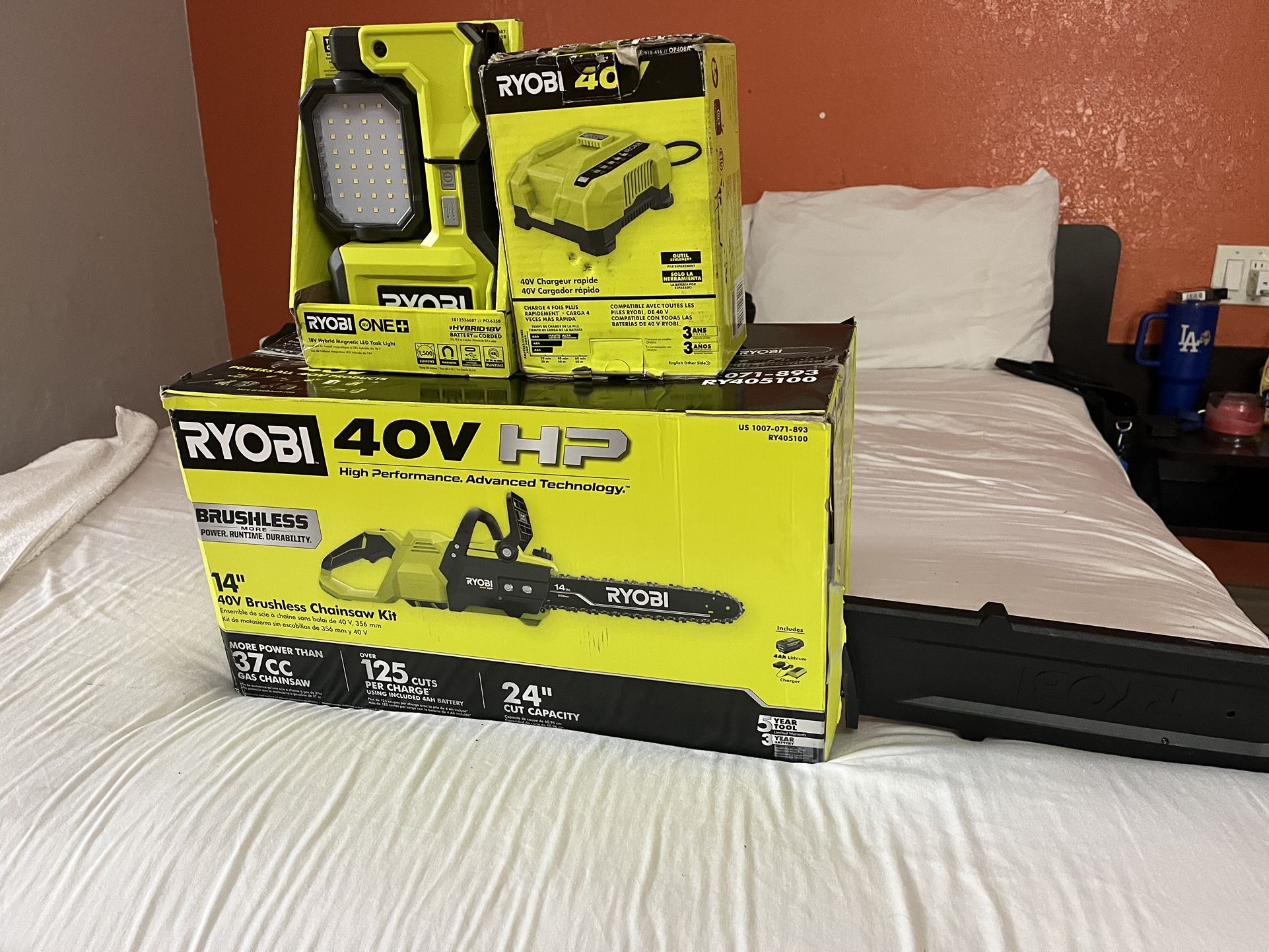 RYOBI CHAIN SAW, CHARGER AND HYBRID MAGNETIC LIGHT