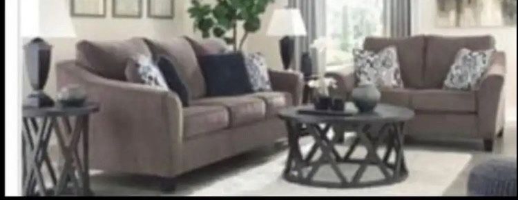 Ashley Signature Design Nemoli - Sofa& Loveseat Taupe $1500 This sofa sets the scene for a modern space full of casual flair. Its textured chenille