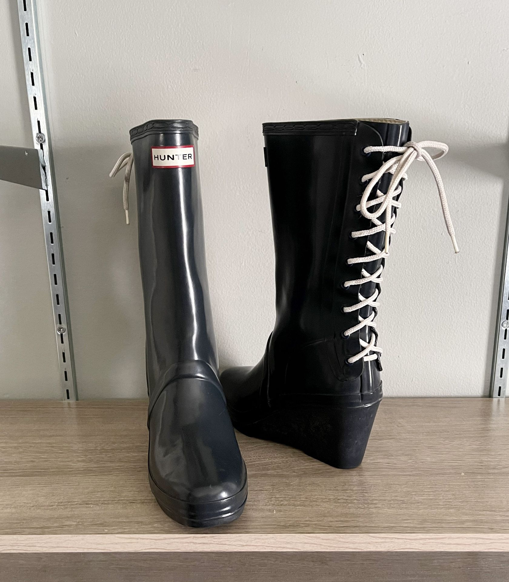 Women’s Hunter Verbier wedge heel rain boots. Color navy blue. Size 8. Retail $195. Great condition! With lace up design on back.