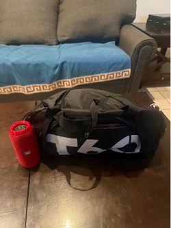 Speaker, sports bag and sunglasses with a headphone