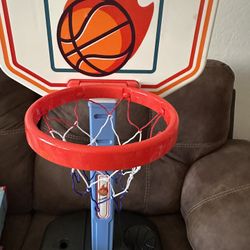 Baby adjustable size basketball hoop  Open box item never used but missing 2 screws and cover for little hole.   Comes with pump and 1 ball