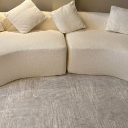CURVED LIVING ROOM SOFA. BRAND NEW.
