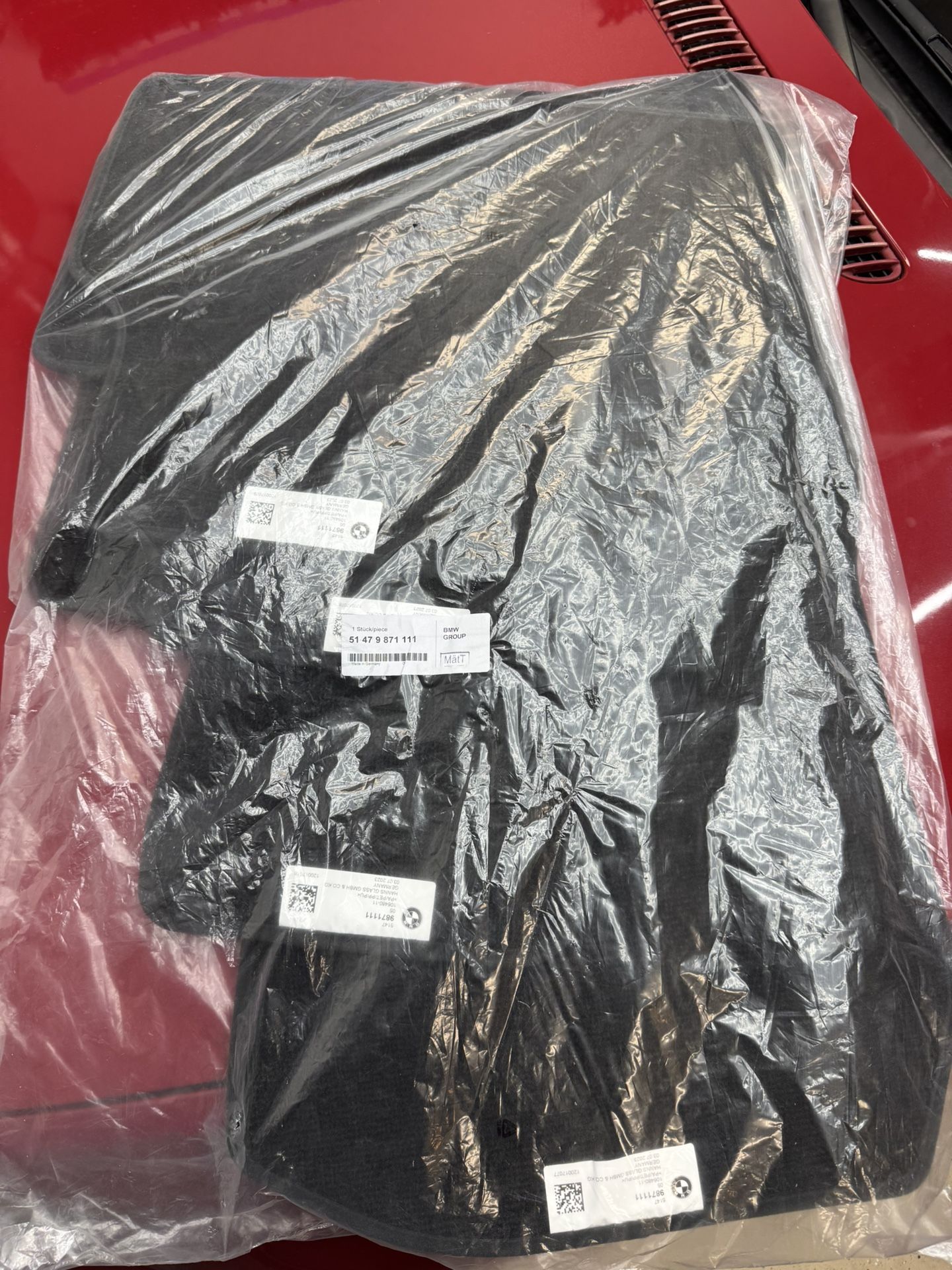 BMW i4 (G26) Floor mats (Front and Rear, Black, brand new OEM)