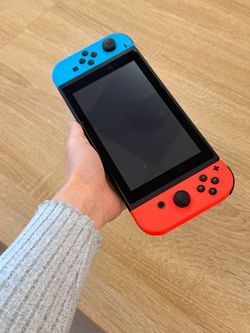 Nintendo Switch - V2 with Red and Blue Joy-Con HAC-001(-01) Fair