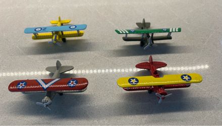 Four Vintage Diecast Miniature Bi-Planes