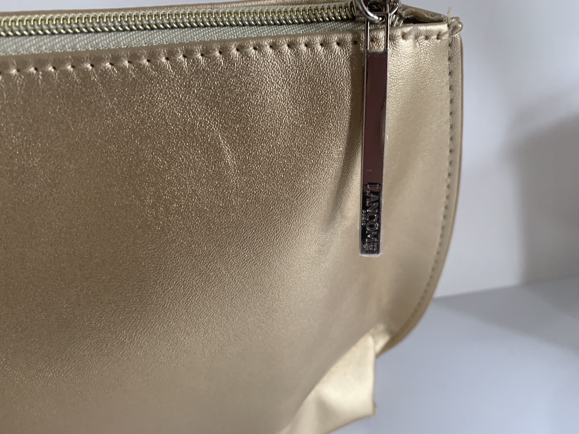 Lancôme Paris gold color gorgeous cosmetic bag. 12”X 6.5”and 2.5”
