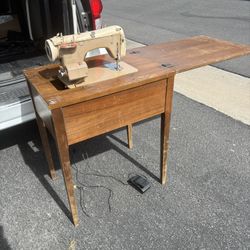 Antique Sewing Machine In Table